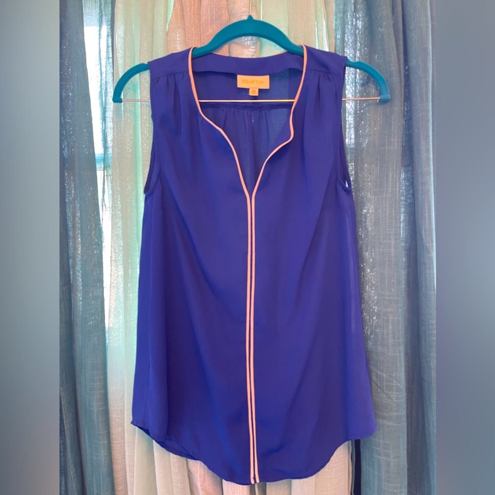 Sleeveless sapphire blue blouse.
